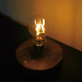 Magic Levitating Lamp Retro Bulb casting a soft glow on a dark wooden base | Cyber Vintage